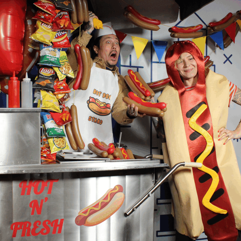 Bullet Time camera array GIF of a man at a hot dog stand and a woman wearing a hot dog costume